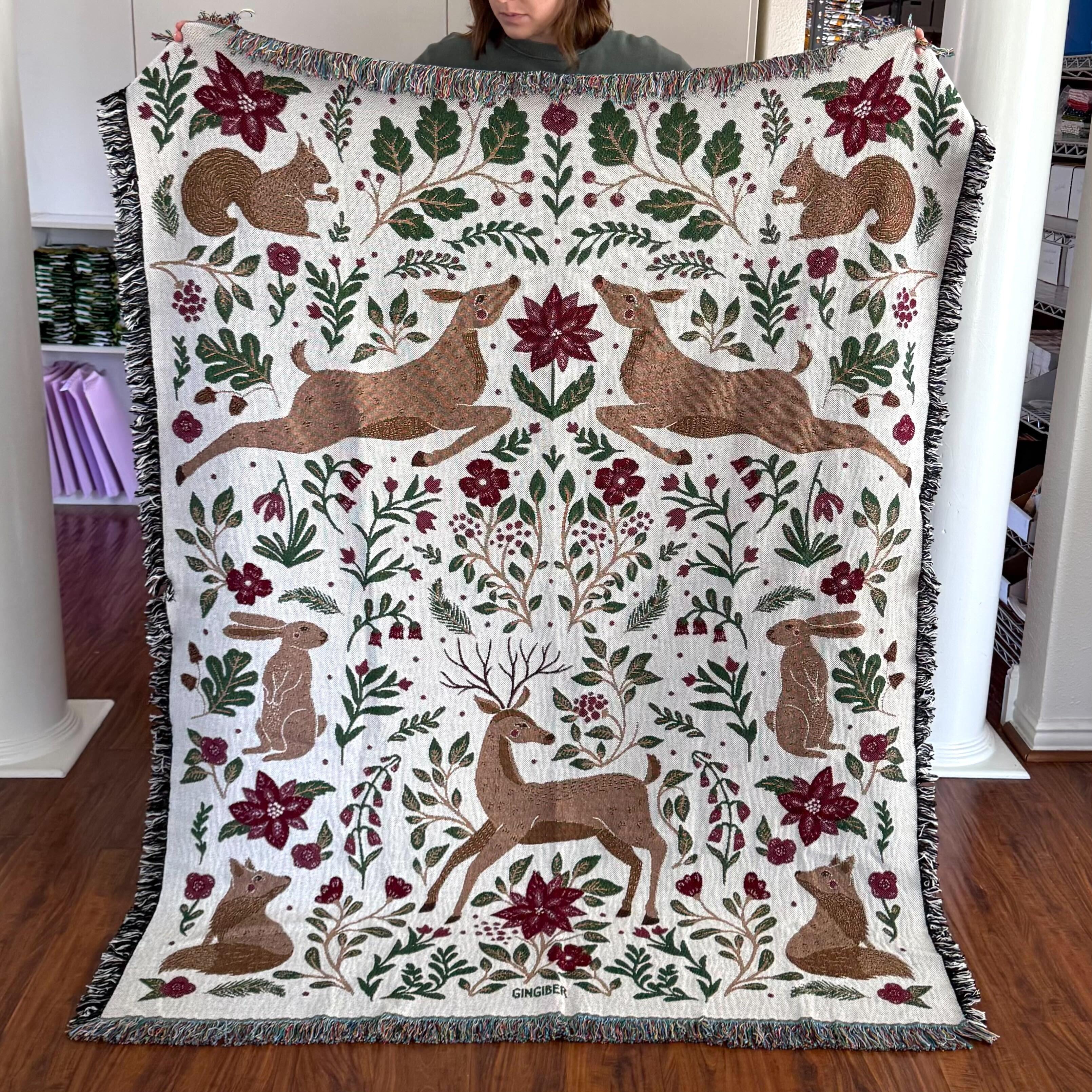 Blanket - woven throw featuring winter and forest animal illustrations on light background
