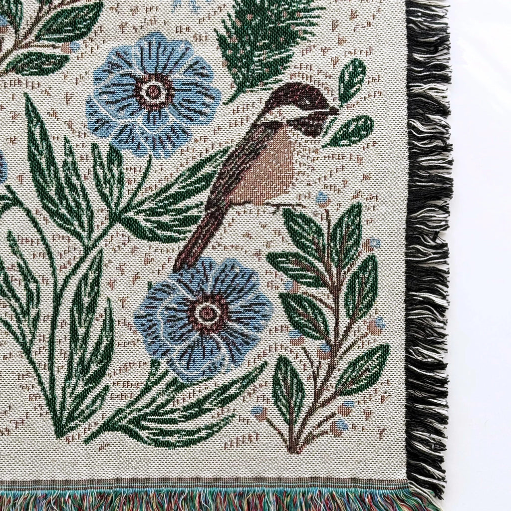 Blanket - woven throw featuring winter and forest animal illustrations on light background