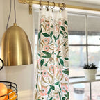 set of two tea towels with bird and floral illustrations