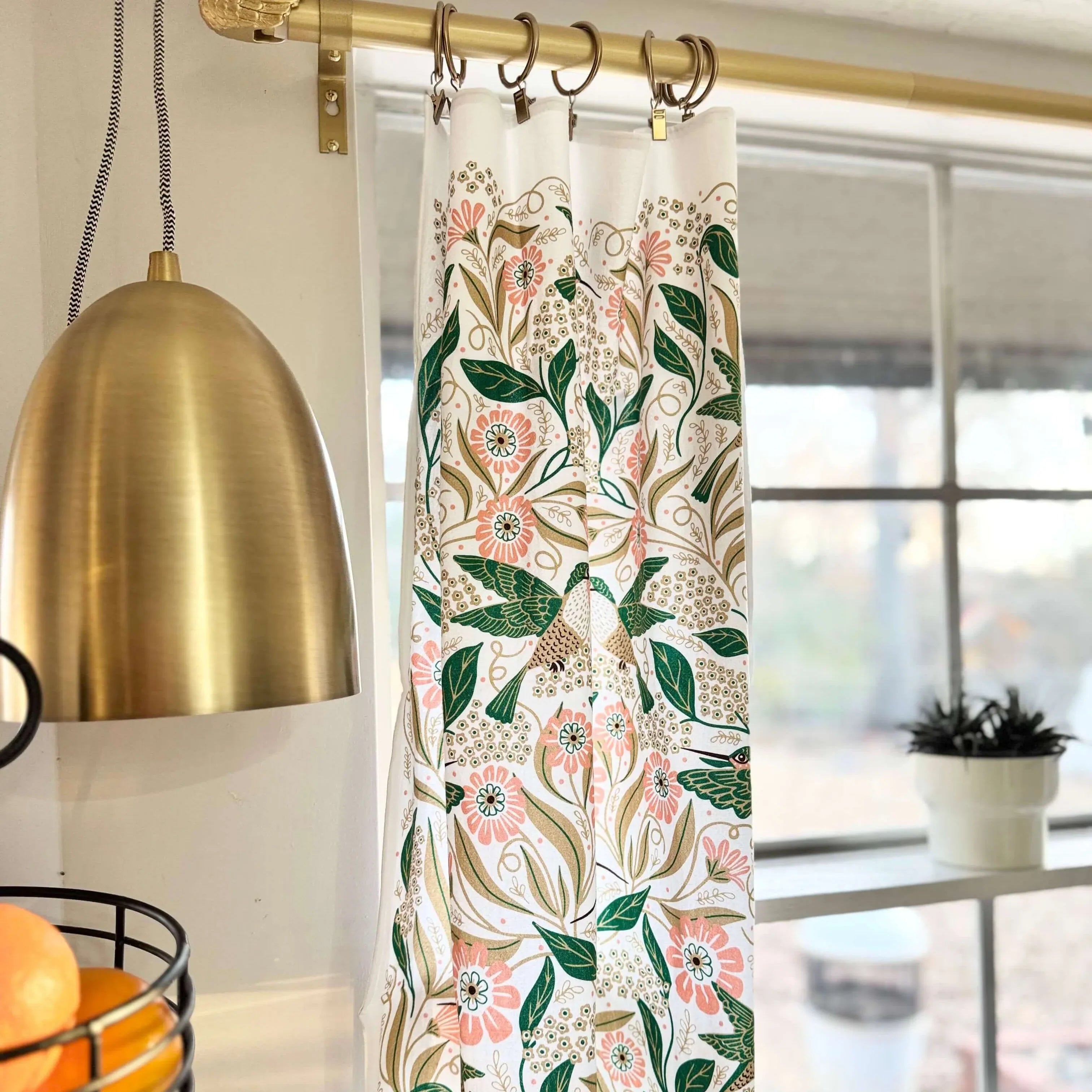 set of two tea towels with bird and floral illustrations