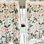 set of two tea towels with bird and floral illustrations