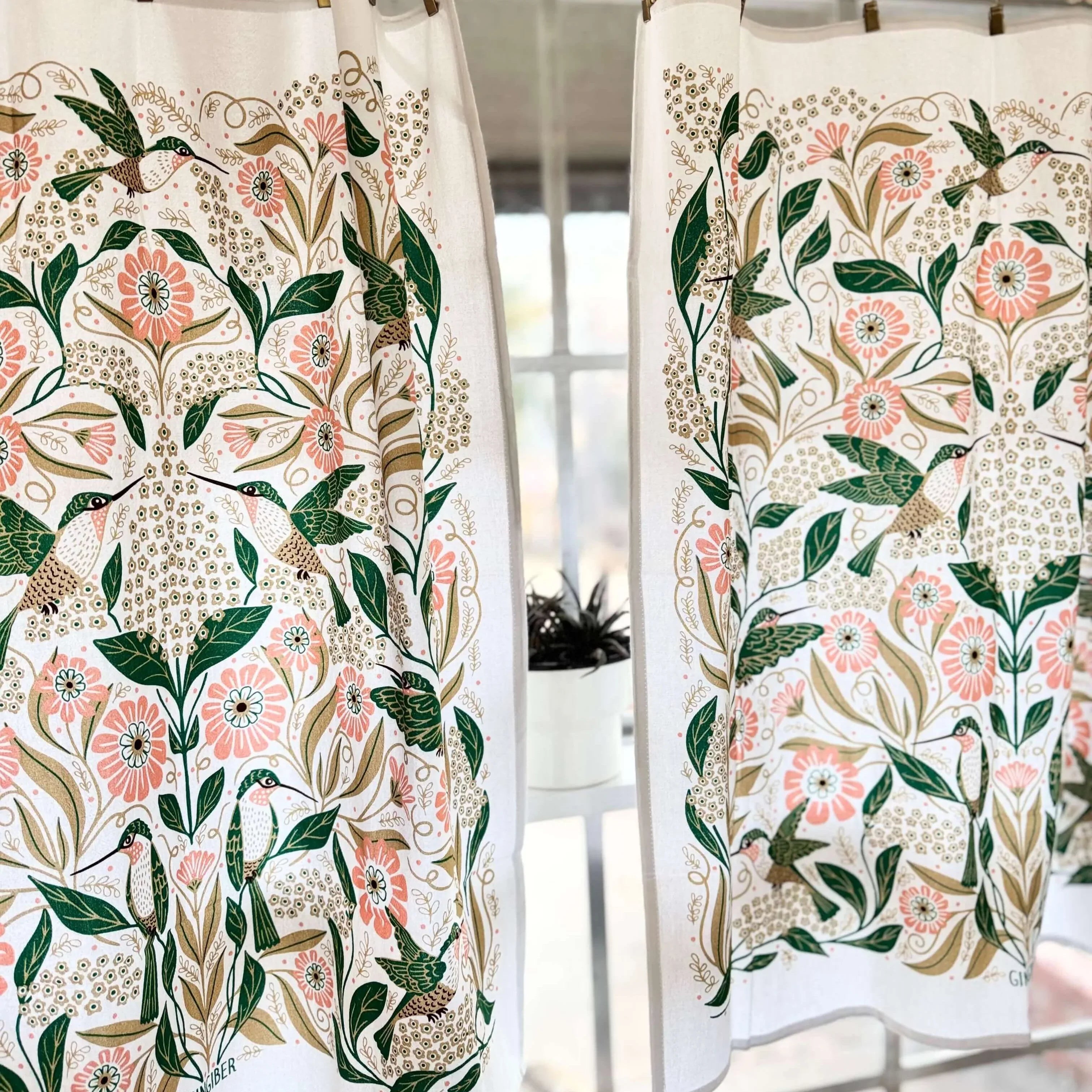 set of two tea towels with bird and floral illustrations