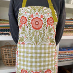Poppy Apron—bake in style with gingiber apron featuring floral poppy print, adjustable neck strap, large pocket, 100% cotton canvas