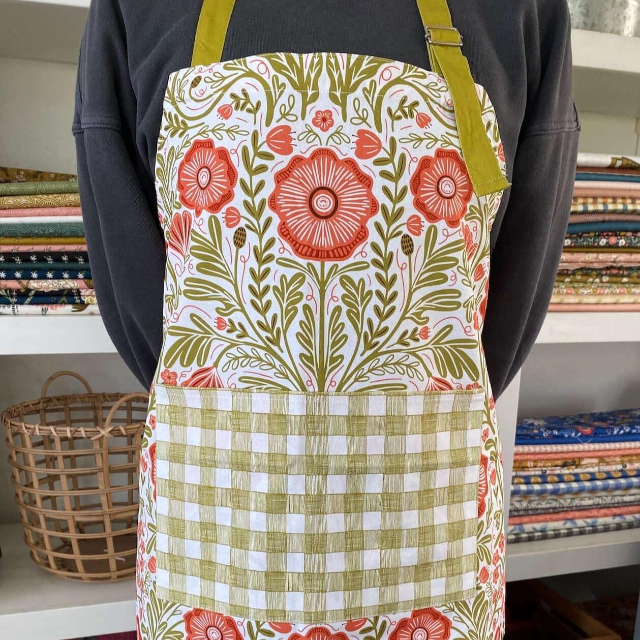 Poppy Apron—bake in style with gingiber apron featuring floral poppy print, adjustable neck strap, large pocket, 100% cotton canvas