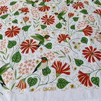 Patterned fabric with hummingbirds and flowers, featuring the brand 'Gingiber'.