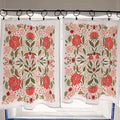 Floral patterned curtains hanging on a rod with a tiled wall background.