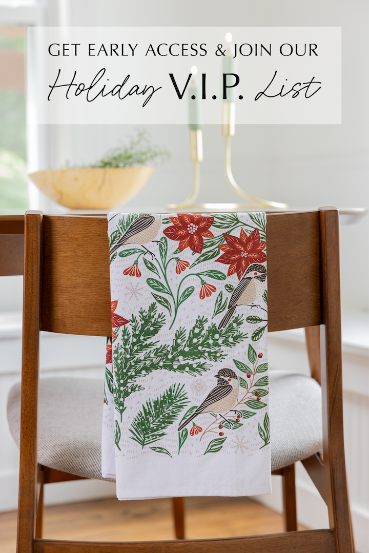 Decorative towel with floral and bird pattern on a chair, with text about joining a holiday VIP list.