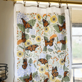 set of two tea towels with butterfly and floral illustrations