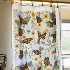 set of two tea towels with butterfly and floral illustrations
