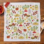 Tea towel with Italian food illustrations on a wooden table