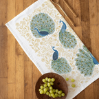 tea towel with peacock and floral illustrations