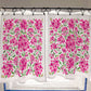 Floral cafe curtain with pink flowers and green leaves on a white background