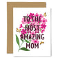 Greeting card with pink flowers and text 'To the most amazing mom' on a white background.
