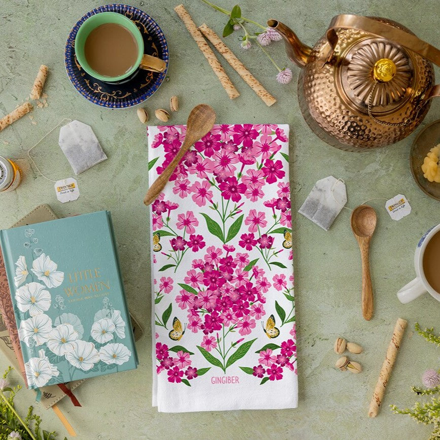 Floral towel on a table with tea accessories