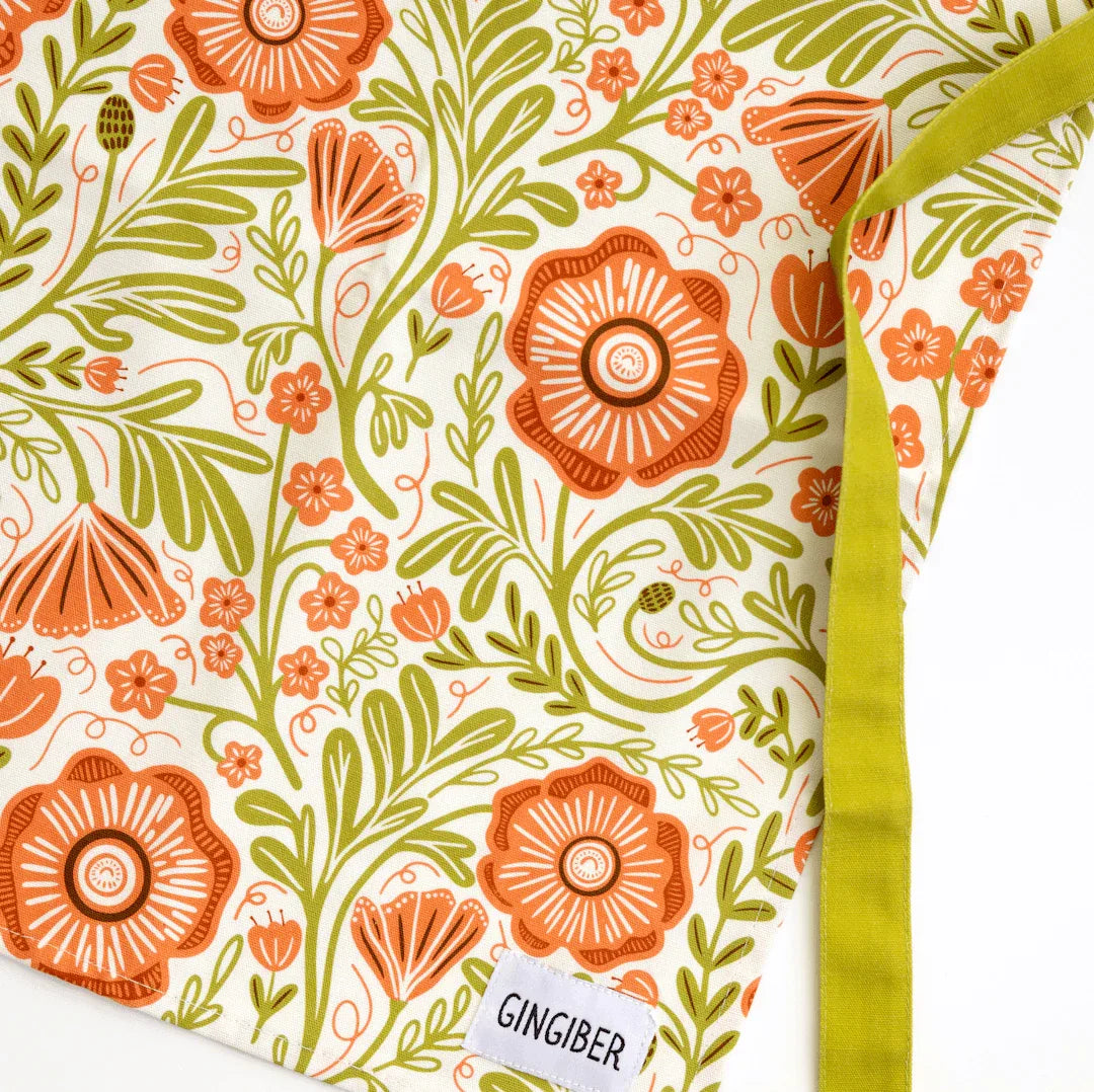Poppy Apron—bake in style with gingiber apron featuring floral poppy print, adjustable neck strap, large pocket, 100% cotton canvas