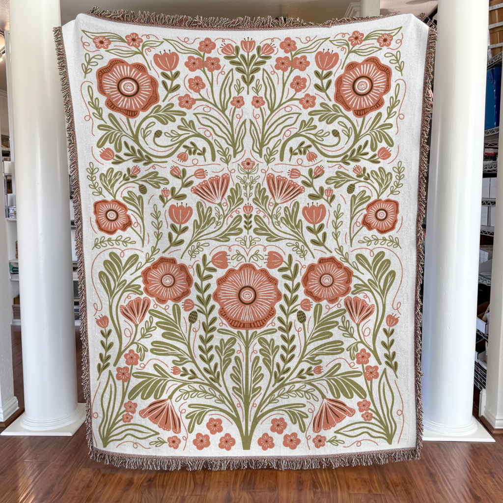 Floral patterned throw blanket on a wooden floor with white columns in the background