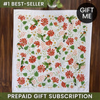 Floral and bird patterned towel with 'Gift Me' and '#1 Best-Seller' text on a wooden surface.