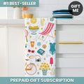 Colorful towel with summer-themed design hanging on a towel rack.