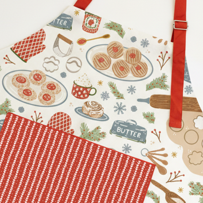 Patterned apron with food illustrations and a red strap