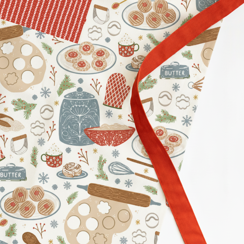 Patterned paper with baking-themed illustrations and a red ribbon.