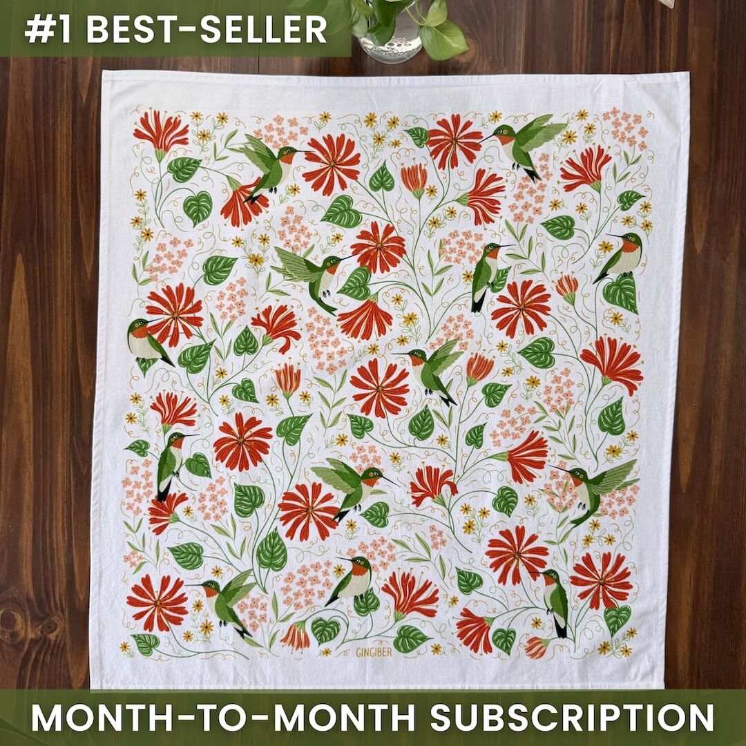 Decorative tablecloth with floral and bird pattern on a wooden surface, labeled as a best-seller with a month-to-month subscription offer.