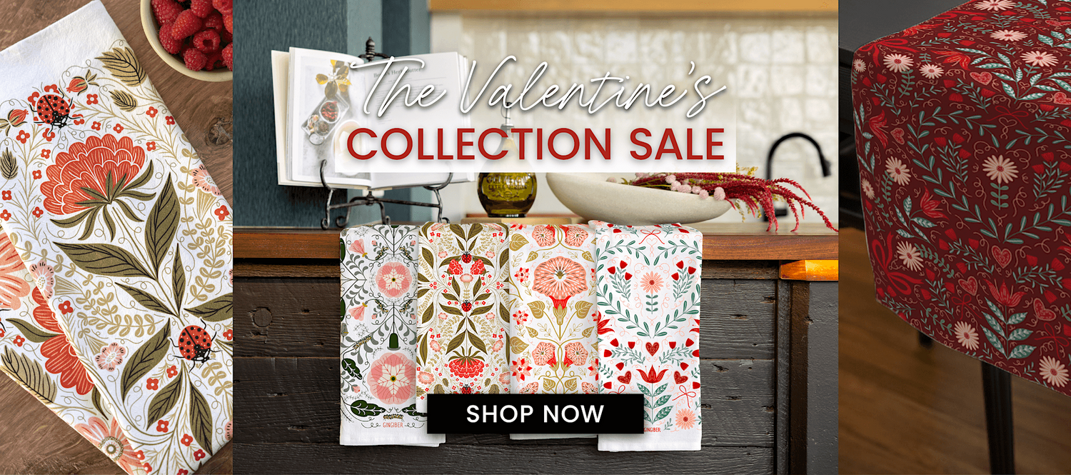 Promotional image for Valentine's Collection Sale with floral table runners and a 'Shop Now' button.