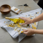 tea towel with illustrated bees and floral elements