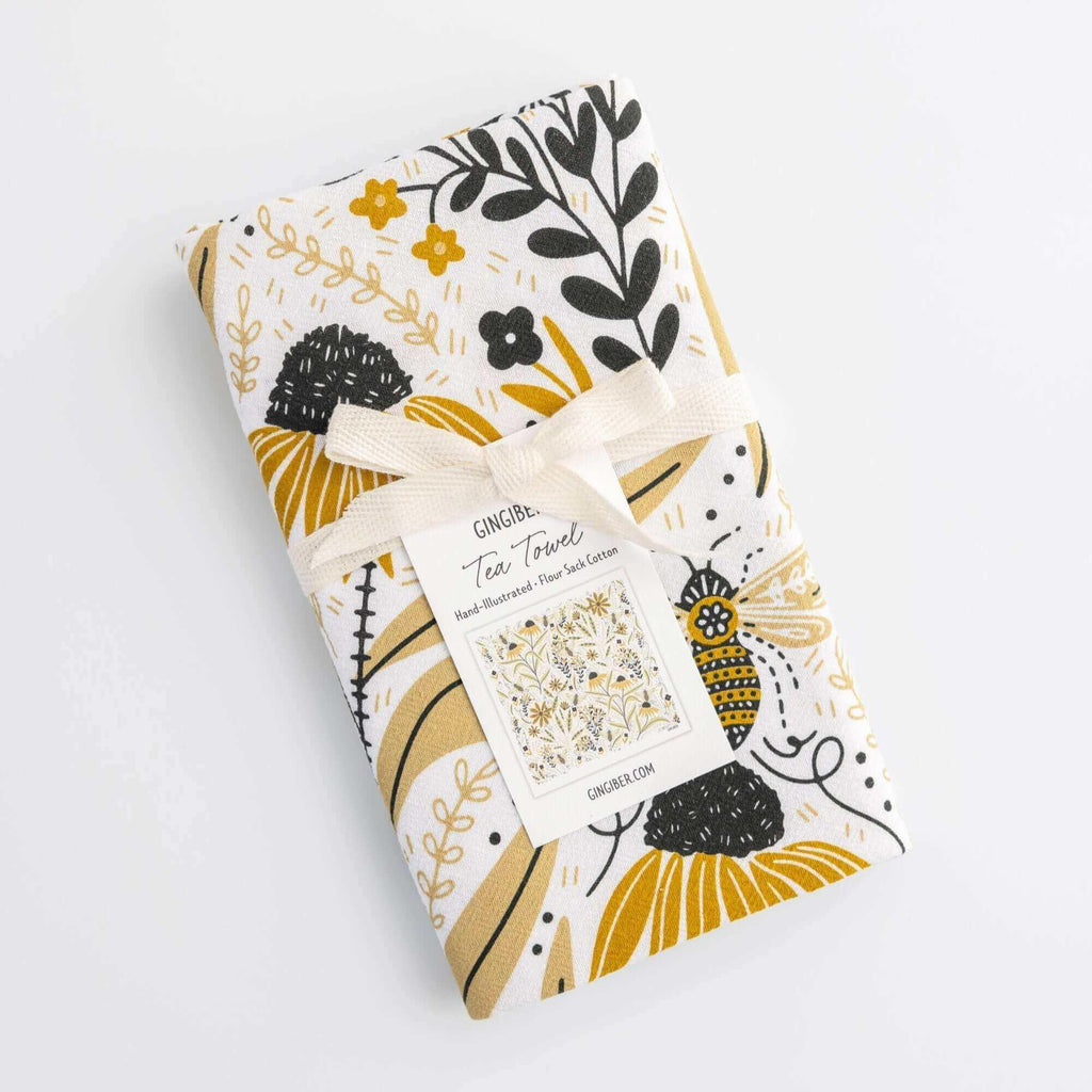 tea towel with illustrated bees and floral elements
