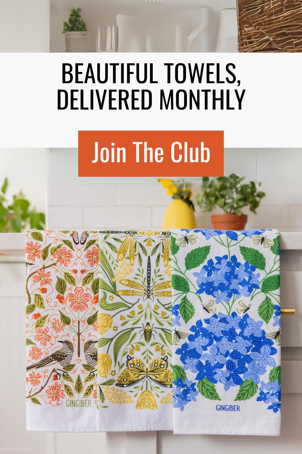 Woman holding a stack of delightfully soft flour sack cotton tea towels