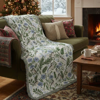 Blanket - woven throw featuring winter and forest animal illustrations on light background