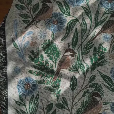 Blanket - woven throw featuring winter and forest animal illustrations on light background