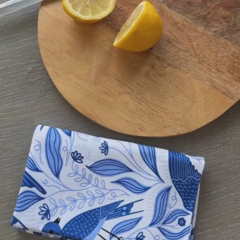 Video of cutting a lemon next to a blue bird towel