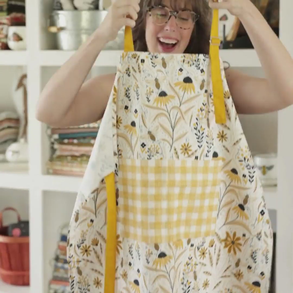 Bee Garden Apron—bake in style with gingiber apron featuring bee & floral print, adjustable neck strap, large pocket, 100% cotton canvas