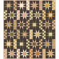 Quilt with star pattern in various colors on a white background
