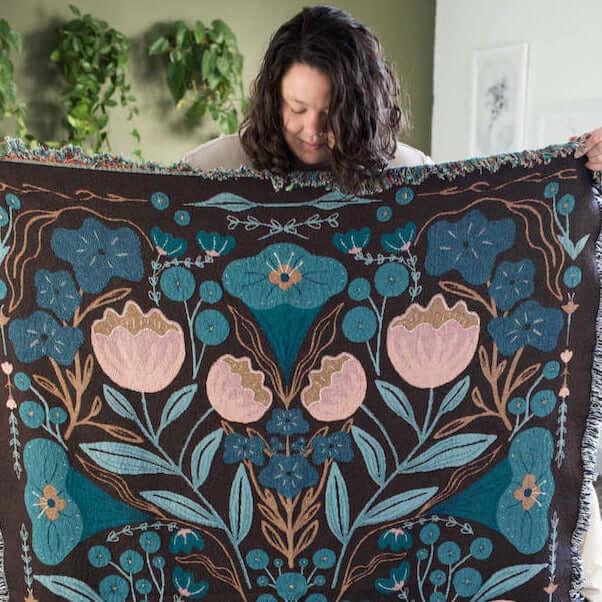 blanket with pink and dark blue floral designs